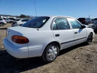 2001 Chevrolet Prizm z VIN 1Y1SK52881Z433402, wystawiony jako Copart lot #81266503 z przebiegiem 86 324 mil mil oraz Czysty tytuł • Clean title. Historia ofert i sprzedaży dostępna na DreamBid. Obrazek 3.
