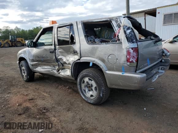 2003 Chevrolet Blazer LS with VIN 1GNDT13X73K152980, listed as a Copart auction lot 71448015 with 102,250 mi miles and Salvage title. Bid and sale history available at DreamBid. Image 2.