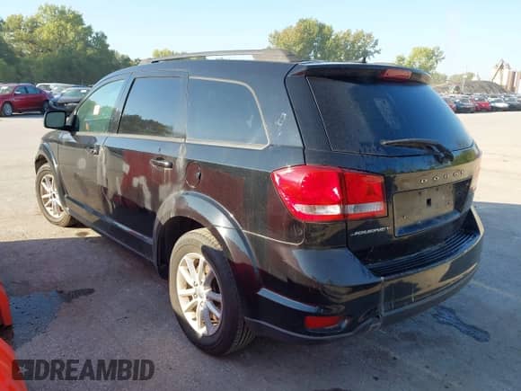 2014 Dodge Journey SXT with VIN 3C4PDCBB0ET124864, listed as a IAAI auction lot 43333855 with 208,280 mi miles and . Bid and sale history available at DreamBid. Image 3.