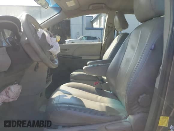 2012 Toyota Sienna with VIN 5TDZK3DC4CS184450, listed as a Copart auction lot 71284385 with 207,878 mi miles and Salvage title. Bid and sale history available at DreamBid. Image 7.