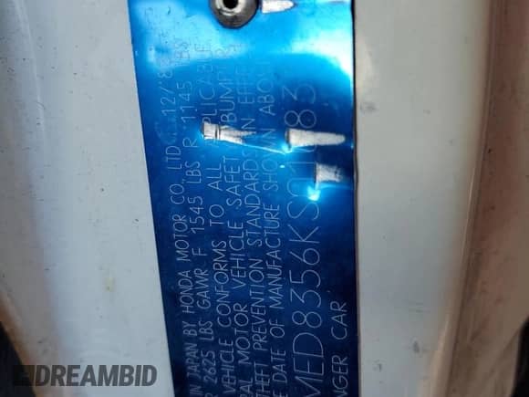 1989 Honda Civic z VIN JHMED8356KS010831, wystawiony jako Copart lot #49439355 z przebiegiem 180 448 mil mil oraz Szkoda całkowita • Salvage title. Historia ofert i sprzedaży dostępna na DreamBid. Obrazek 14.