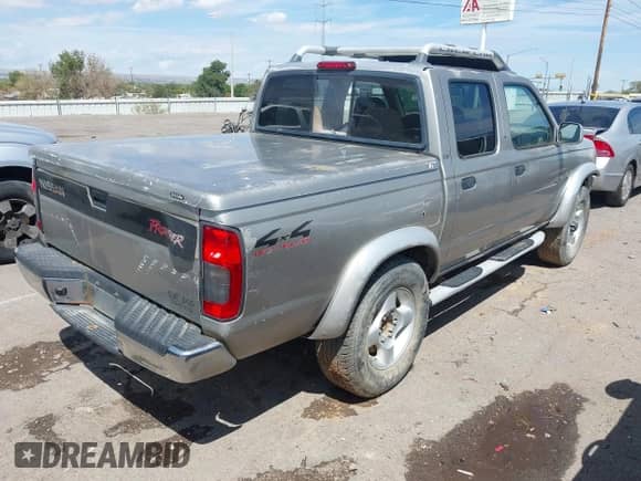 2000 Nissan Frontier XE with VIN 1N6ED27Y9YC410434, listed as a IAAI auction lot 43094421 with 240,476 mi miles and . Bid and sale history available at DreamBid. Image 4.