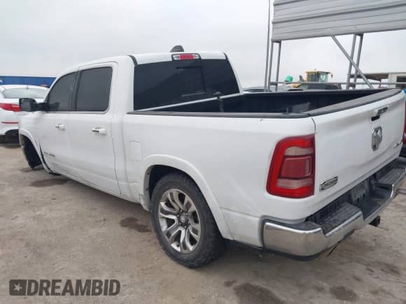 2020 Ram 1500 Longhorn with VIN 1C6SRFKT5LN304433, listed as a IAAI auction lot 41172491 with 121,344 mi miles and . Bid and sale history available at DreamBid. Image 3.