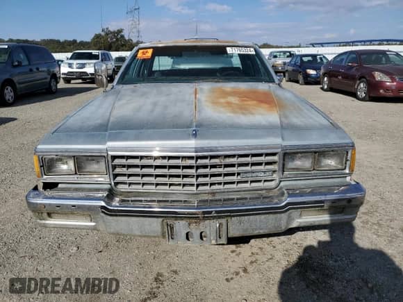 1985 Chevrolet Caprice с VIN 1G1BN69HXFX143536, выставлен на аукционе Copart как лот 71765324 с пробегом 14 242 миль миль и Чистый • Clean title. История ставок и продаж доступна на DreamBid. Изображение 5.