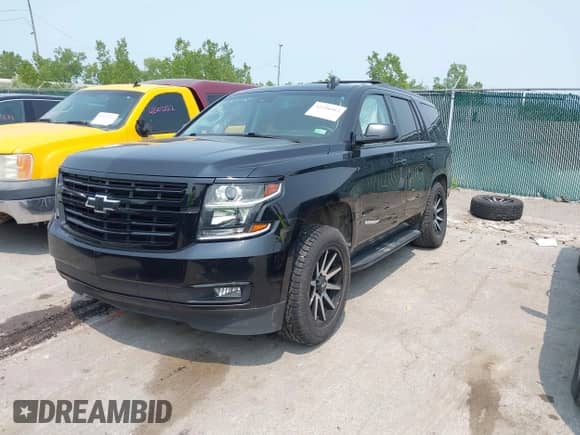 2018 Chevrolet Tahoe LT z VIN 1GNSKBKC2JR217172, wystawiony jako IAAI lot #42356962 z przebiegiem 129 130 mil mil oraz . Historia ofert i sprzedaży dostępna na DreamBid. Obrazek 18.