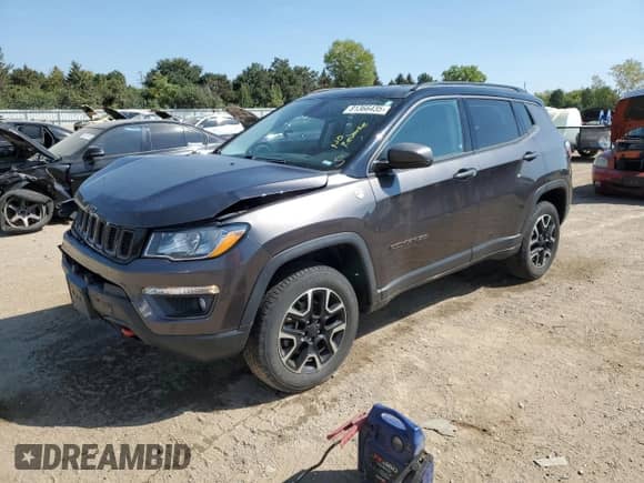 2020 Jeep Compass Trailhawk with VIN 3C4NJDDBXLT163395, listed as a Copart auction lot 81366435 with 56,199 mi miles and Salvage title. Bid and sale history available at DreamBid. Image 1.