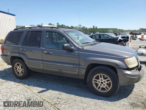 2004 Jeep Grand Cherokee Laredo with VIN 1J4GX48S94C381627, listed as a Copart auction lot 70754855 with 318,672 mi miles and Salvage title. Bid and sale history available at DreamBid. Image 4.