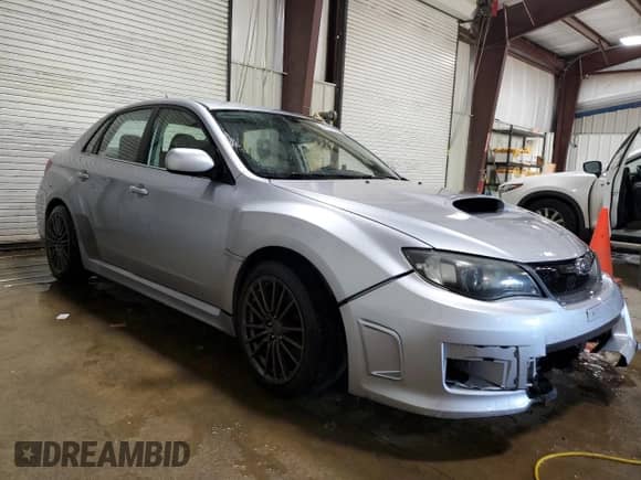 2012 Subaru WRX WRX with VIN JF1GV7E65CG002737, listed as a Copart auction lot 54720265 with 94,311 mi miles and Salvage title. Bid and sale history available at DreamBid. Image 4.