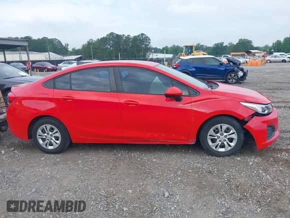 2019 Chevrolet Cruze z VIN 1G1BJ5SM8K7101860, wystawiony jako IAAI lot #42294257 z przebiegiem 120 504 mil mil oraz . Historia ofert i sprzedaży dostępna na DreamBid. Obrazek 13.