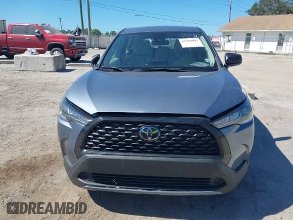 2022 Toyota Corolla Cross L with VIN 7MUAAAAG7NV029721, listed as a IAAI auction lot 43304097 with 31,139 mi miles and . Bid and sale history available at DreamBid. Image 12.