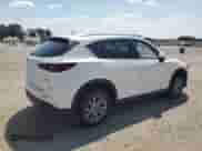 2023 Mazda CX-5 S Select z VIN JM3KFBBM4P0239426, wystawiony jako Copart lot #62167105 z przebiegiem 14 333 mil mil oraz Szkoda całkowita • Salvage title. Historia ofert i sprzedaży dostępna na DreamBid. Obrazek 3.