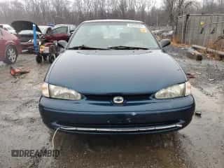 2000 Chevrolet Prizm z VIN 1Y1SK528XYZ418233, wystawiony jako Copart lot #83036344 z przebiegiem Nie podano mil oraz Szkoda całkowita • Salvage title. Historia ofert i sprzedaży dostępna na DreamBid. Obrazek 5.