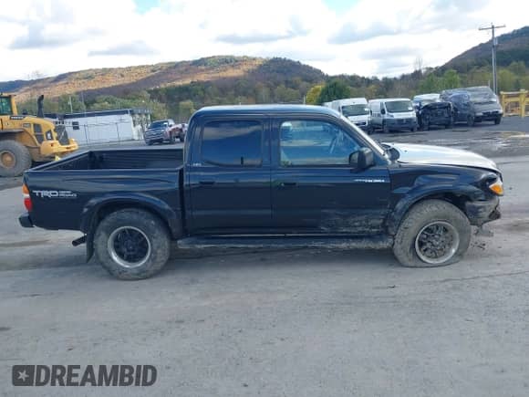 2003 Toyota Tacoma z VIN 5TEHN72N53Z249453, wystawiony jako IAAI lot #43472155 z przebiegiem 162 053 mil mil oraz . Historia ofert i sprzedaży dostępna na DreamBid. Obrazek 13.