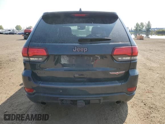 2017 Jeep Grand Cherokee Trailhawk z VIN 1C4RJFLG0HC807936, wystawiony jako Copart lot #71960485 z przebiegiem 143 040 mil mil oraz Szkoda całkowita • Salvage title. Historia ofert i sprzedaży dostępna na DreamBid. Obrazek 6.