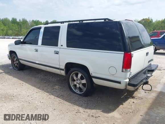 1999 Chevrolet Suburban with VIN 3GNEC16R2XG127337, listed as a IAAI auction lot 42061752 with 210,723 mi miles and . Bid and sale history available at DreamBid. Image 3.