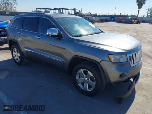 2012 Jeep Grand Cherokee Limited z VIN 1C4RJEBG1CC305182, wystawiony jako IAAI lot #43527445 z przebiegiem 164 219 mil mil oraz . Historia ofert i sprzedaży dostępna na DreamBid. Obrazek 1.