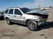 2003 Jeep Grand Cherokee Laredo z VIN 1J4GX48S53C581242, wystawiony jako Copart lot #70820065 z przebiegiem 212 955 mil mil oraz Szkoda całkowita • Salvage title. Historia ofert i sprzedaży dostępna na DreamBid. Obrazek 4.