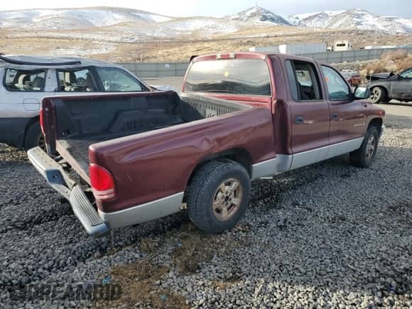2002 Dodge Dakota SLT with VIN 1B7HL48N52S525130, listed as a Copart auction lot 85956494 with 220,368 mi miles and Salvage title. Bid and sale history available at DreamBid. Image 3.