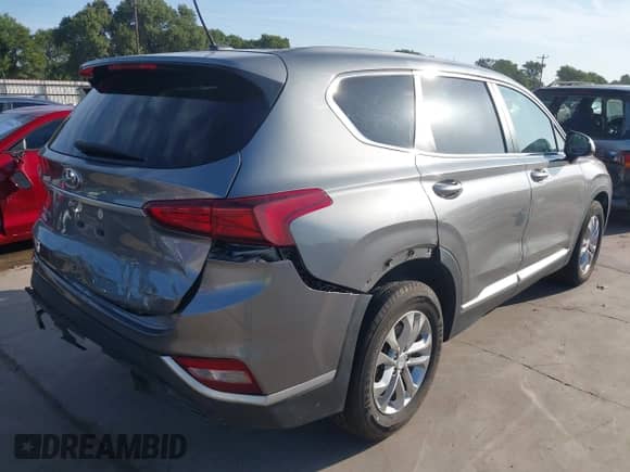 2019 Hyundai Santa Fe SE with VIN 5NMS2CAD1KH116655, listed as a IAAI auction lot 42865036 with 80,643 mi miles and . Bid and sale history available at DreamBid. Image 4.