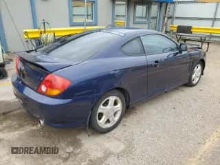 2003 Hyundai Tiburon GT с VIN KMHHN65F73U018847, выставлен на аукционе Copart как лот 58242385 с пробегом 164 976 миль миль и Списание • Salvage title. История ставок и продаж доступна на DreamBid. Изображение 3.