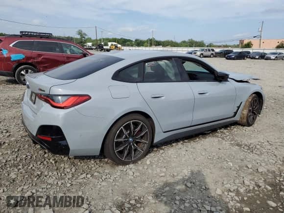 2023 BMW i4 M50 with VIN WBY33AW03PFN79198, listed as a Copart auction lot 61933085 with Not provided miles and Salvage title. Bid and sale history available at DreamBid. Image 3.