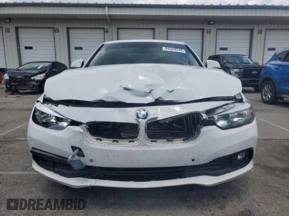 2016 BMW 3 Series 320i with VIN WBA8E1G59GNT99335, listed as a Copart auction lot 64949345 with 128,784 mi miles and Salvage title. Bid and sale history available at DreamBid. Image 5.