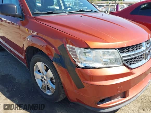 2013 Dodge Journey American Value z VIN 3C4PDCAB1DT626671, wystawiony jako IAAI lot #42828028 z przebiegiem 238 028 mil mil oraz . Historia ofert i sprzedaży dostępna na DreamBid. Obrazek 6.