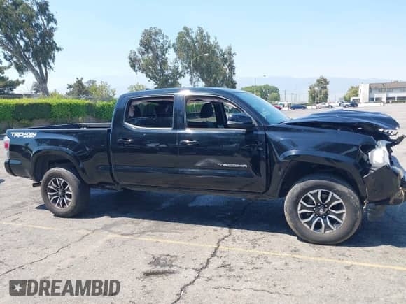 2023 Toyota Tacoma SR5 z VIN 3TMDZ5BN7PM148621, wystawiony jako IAAI lot #42928723 z przebiegiem 70 708 mil mil oraz . Historia ofert i sprzedaży dostępna na DreamBid. Obrazek 13.