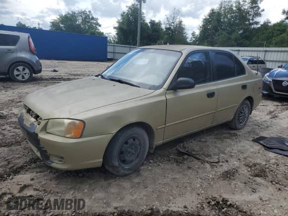 2002 Hyundai Accent GL z VIN KMHCG45C02U296132, wystawiony jako Copart lot #59401835 z przebiegiem 115 421 mil mil oraz Czysty tytuł • Clean title. Historia ofert i sprzedaży dostępna na DreamBid. Obrazek 1.
