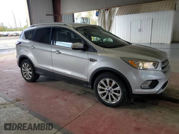 2017 Ford Escape Titanium с VIN 1FMCU0JD1HUE53434, выставлен на аукционе Copart как лот 44222165 с пробегом 129 642 миль миль и Списание • Salvage title. История ставок и продаж доступна на DreamBid. Изображение 4.