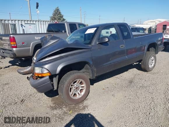 2004 Dodge Dakota with VIN 1D7HG12K64S549799, listed as a IAAI auction lot 42953180 with 128,822 mi miles and . Bid and sale history available at DreamBid. Image 2.