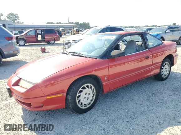 1995 Saturn SC with VIN 1G8ZE1285SZ141155, listed as a Copart auction lot 65757374 with 150,973 mi miles and Salvage title. Bid and sale history available at DreamBid. Image 1.