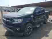 2021 Chevrolet Colorado 4WD Z71 z VIN 1GCGTDEN1M1256939, wystawiony jako IAAI lot #42071364 z przebiegiem 38 972 mil mil oraz . Historia ofert i sprzedaży dostępna na DreamBid. Obrazek 2.
