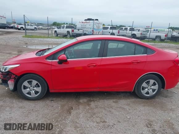 2018 Chevrolet Cruze LS z VIN 1G1BC5SMXJ7100220, wystawiony jako IAAI lot #42800342 z przebiegiem 69 739 mil mil oraz . Historia ofert i sprzedaży dostępna na DreamBid. Obrazek 15.