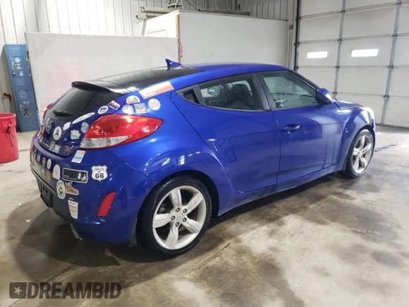 2012 Hyundai Veloster w/Black Int z VIN KMHTC6AD3CU078659, wystawiony jako Copart lot #71902465 z przebiegiem 130 632 mil mil oraz Szkoda całkowita • Salvage title. Historia ofert i sprzedaży dostępna na DreamBid. Obrazek 3.