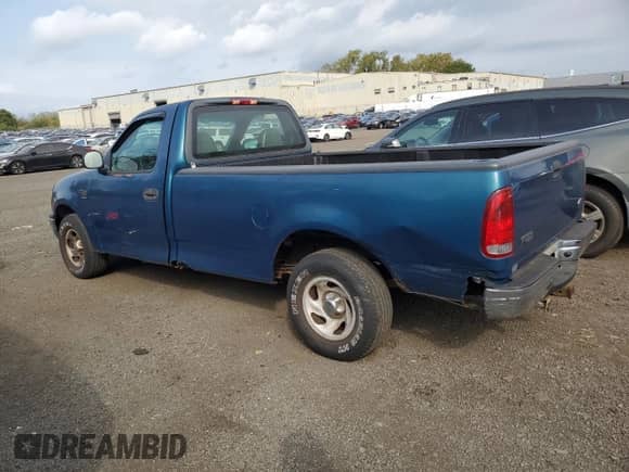 2001 Ford F-150 XL with VIN 1FTRF17W71NA44992, listed as a Copart auction lot 81205035 with 125,671 mi miles and Salvage title. Bid and sale history available at DreamBid. Image 2.