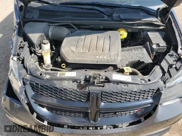 2016 Dodge Grand Caravan American Value with VIN 2C4RDGBG0GR252054, listed as a Copart auction lot 71838825 with 128,684 mi miles and Salvage title. Bid and sale history available at DreamBid. Image 12.