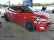 2013 Hyundai Veloster w/Black Int z VIN KMHTC6AD1DU108579, wystawiony jako Copart lot #69996895 z przebiegiem 187 355 mil mil oraz Szkoda całkowita • Salvage title. Historia ofert i sprzedaży dostępna na DreamBid. Obrazek 4.