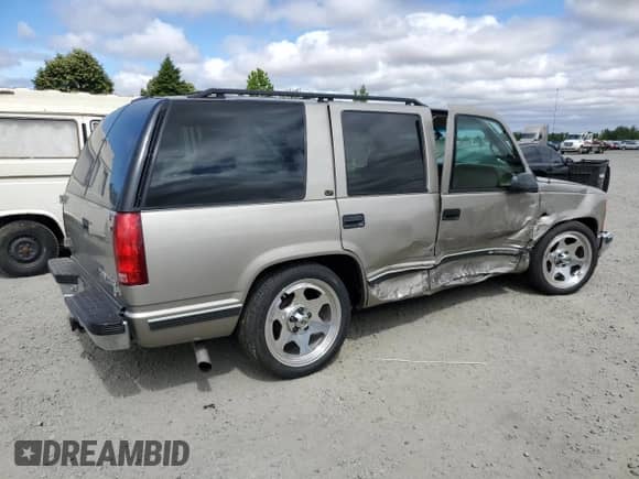 1999 Chevrolet Tahoe with VIN 1GNEC13R0XJ546712, listed as a Copart auction lot 62722745 with 108,864 mi miles and Salvage title. Bid and sale history available at DreamBid. Image 3.