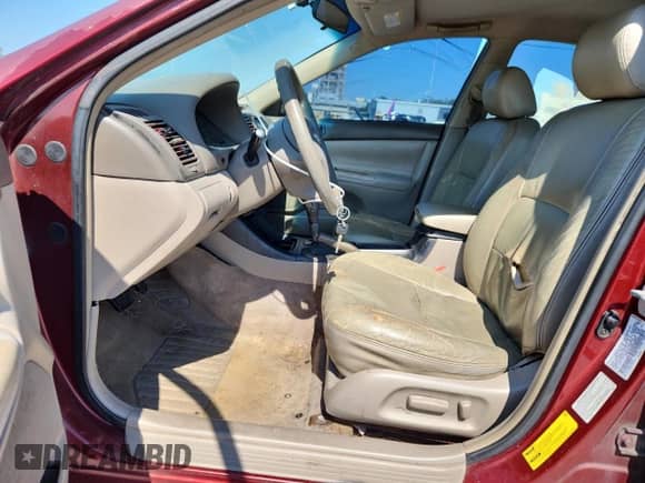 2002 Toyota Camry LE z VIN 4T1BE30K82U082841, wystawiony jako Copart lot #80754015 z przebiegiem 192 738 mil mil oraz Szkoda całkowita • Salvage title. Historia ofert i sprzedaży dostępna na DreamBid. Obrazek 7.