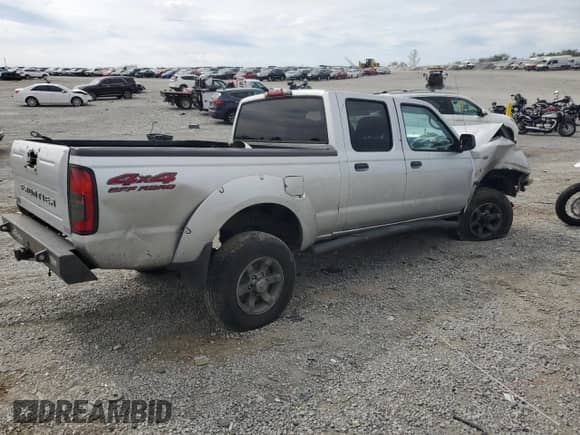 2004 Nissan Frontier XE z VIN 1N6ED29Y24C409987, wystawiony jako Copart lot #69948344 z przebiegiem 193 245 mil mil oraz Szkoda całkowita • Salvage title. Historia ofert i sprzedaży dostępna na DreamBid. Obrazek 3.