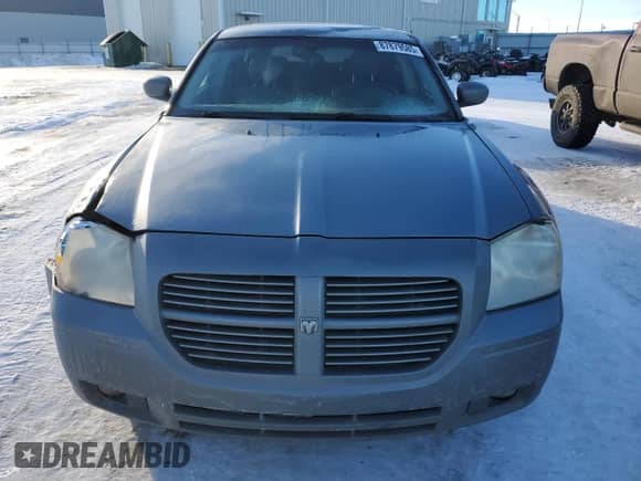 2006 Dodge Magnum R/T с VIN 2D4GV57256H187683, выставлен на аукционе Copart как лот 87879585 с пробегом 260 895 миль миль и Списание • Salvage title. История ставок и продаж доступна на DreamBid. Изображение 5.