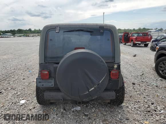 2000 Jeep Wrangler Sport z VIN 1J4FA49S7YP741858, wystawiony jako Copart lot #59058075 z przebiegiem 223 876 mil mil oraz Czysty tytuł • Clean title. Historia ofert i sprzedaży dostępna na DreamBid. Obrazek 6.