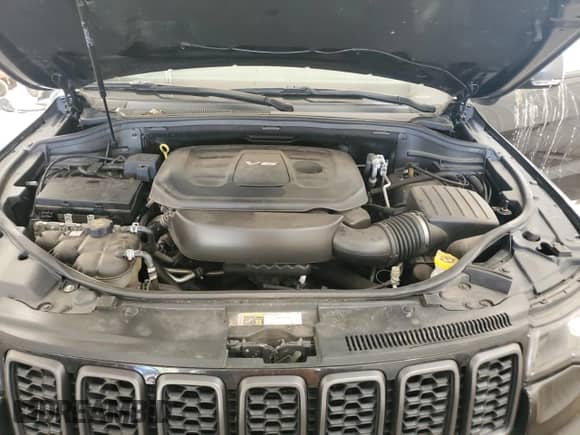 2019 Jeep Grand Cherokee Trailhawk with VIN 1C4RJFLG8KC613582, listed as a Copart auction lot 56102795 with 136,809 mi miles and Salvage title. Bid and sale history available at DreamBid. Image 12.