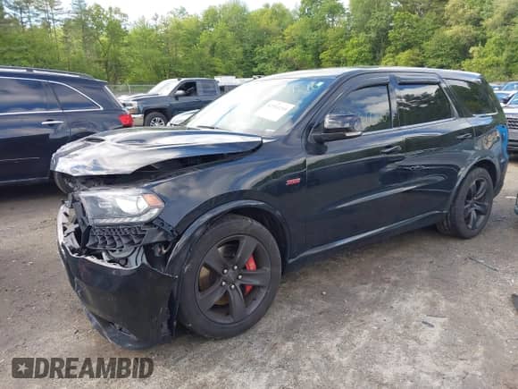 2018 Dodge Durango SRT with VIN 1C4SDJGJ7JC498294, listed as a IAAI auction lot 42311210 with 66,799 mi miles and . Bid and sale history available at DreamBid. Image 2.