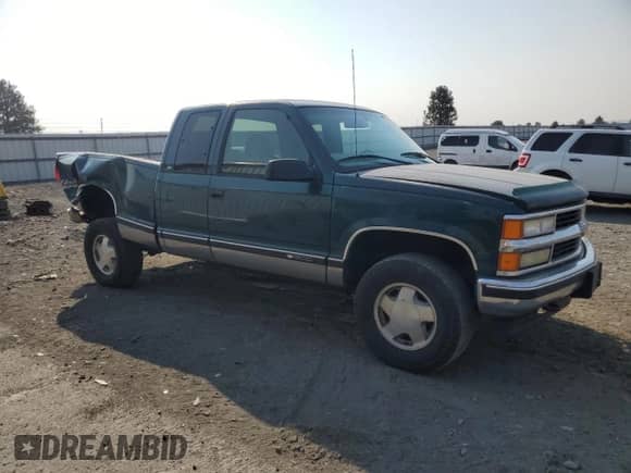 1998 Chevrolet Silverado 1500 with VIN 2GCEK19RXW1116889, listed as a Copart auction lot 70948515 with 238,720 mi miles and Salvage title. Bid and sale history available at DreamBid. Image 4.