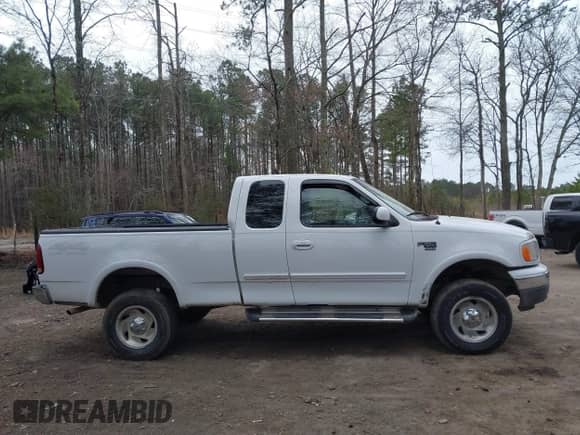 2000 Ford F-150 XL with VIN 1FTRX18L3YNA61333, listed as a IAAI auction lot 41727187 with Not provided miles and . Bid and sale history available at DreamBid. Image 13.