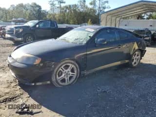 2006 Hyundai Tiburon GS с VIN KMHHM65D06U207409, выставлен на аукционе Copart как лот 80970414 с пробегом 173 396 миль миль и Списание • Salvage title. История ставок и продаж доступна на DreamBid. Изображение 1.