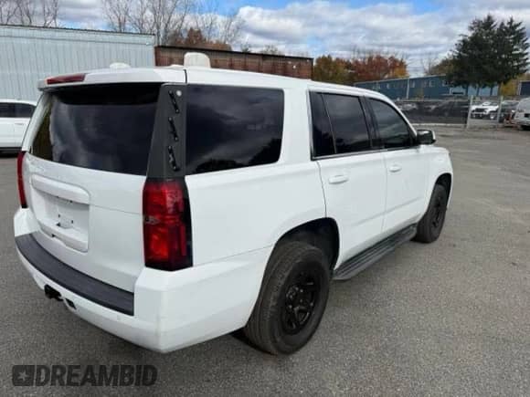 2017 Chevrolet Tahoe Commercial with VIN 1GNLCDEC8HR190627, listed as a Copart auction lot 90938175 with 123,362 mi miles and Clean title. Bid and sale history available at DreamBid. Image 4.