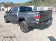 2021 Toyota Tacoma SR with VIN 3TYCZ5AN0MT027247, listed as a IAAI auction lot 43234020 with 26,058 mi miles and . Bid and sale history available at DreamBid. Image 3.